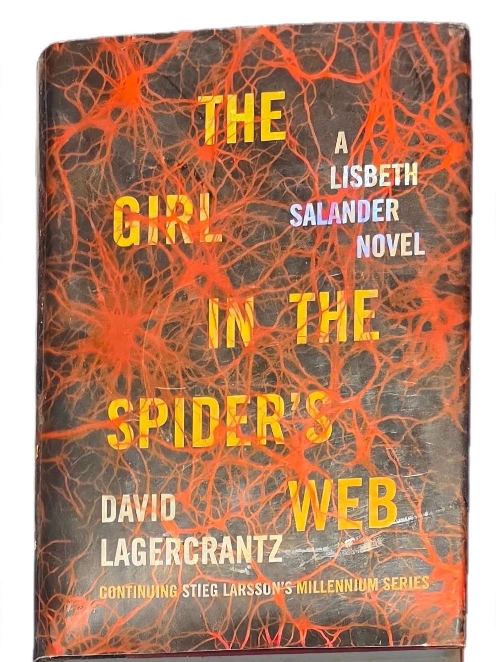 The Girl in the Spider's Web - Orange/Black Hardcover Novel
